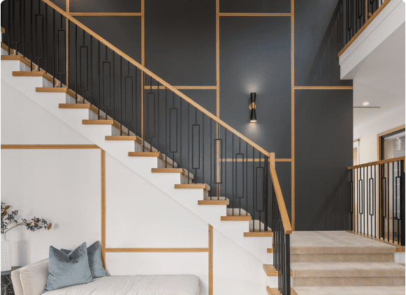 Modern staircase with geometric wall design